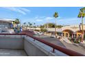 View from a balcony overlooking a quaint town square at 7039 E Main St # A206, Scottsdale, AZ 85251