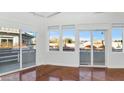 Bright living room with sliding doors to balcony and fireplace at 7039 E Main St # A206, Scottsdale, AZ 85251