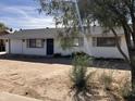 House exterior, showcasing a front yard and driveway at 731 E Manor Dr, Casa Grande, AZ 85122