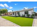 House exterior featuring a well-manicured lawn and modern design at 7715 E Catalina Dr, Scottsdale, AZ 85251