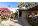 Inviting exterior with landscaped walkway and entry at 7732 E Desert Flower Ave, Mesa, AZ 85208