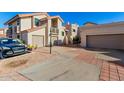 Two-story home with attached garage and driveway parking at 7800 E Lincoln Dr # 2053, Scottsdale, AZ 85250