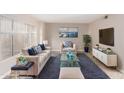 Light beige living room with blue accents and stylish decor at 8039 N 48Th Ave, Glendale, AZ 85302