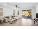 Spacious living room with large sliding glass door and neutral decor at 8908 W Bethany Heights Dr, Glendale, AZ 85305