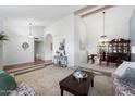 Elegant dining room showcasing a rich wood table and a display cabinet at 9041 E Ludlow Dr, Scottsdale, AZ 85260