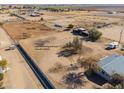 Aerial view showing expansive property with horse pens at 10137 N White Rd, Maricopa, AZ 85139