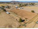 Aerial view of property with large riding arena at 10137 N White Rd, Maricopa, AZ 85139