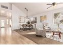 Bright dining room with hardwood floors and stylish light fixture at 1503 N Quail Ln, Gilbert, AZ 85233