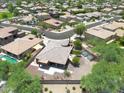 Aerial view of house, yard, and neighborhood, showcasing curb appeal at 15338 W Montecito Ave, Goodyear, AZ 85395