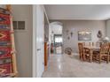 View of dining area with wooden table and access to the living room at 16005 S 10Th Pl, Phoenix, AZ 85048