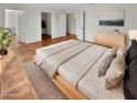 Main bedroom with wood flooring and neutral color scheme at 18206 N 86Th Ln, Peoria, AZ 85382