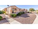 Single-story home with a landscaped yard and a gated entryway at 18212 N 136Th Ave, Sun City West, AZ 85375