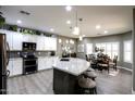 Modern kitchen featuring granite countertops and stainless steel appliances at 20509 N Enchantment Pass, Maricopa, AZ 85138