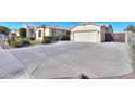 Spacious driveway leading to a two-car garage at 2142 W Enfield Way, Chandler, AZ 85286