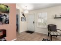 Bright and airy entryway with tile flooring and a view to the living room at 24502 S Starcrest Dr, Sun Lakes, AZ 85248