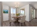 Dining area with wood table and chairs, plus access to patio at 25233 N 131St Dr, Peoria, AZ 85383