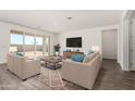 Bright living room with tile floors and sliding glass doors at 25233 N 131St Dr, Peoria, AZ 85383