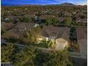 Night view of a house and neighborhood, showing surrounding homes and landscape at 3111 E Red Oak Ct, Gilbert, AZ 85297