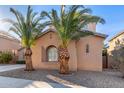 Two-story house with palm trees and a decorative window at 3959 E Gemini Pl, Chandler, AZ 85249