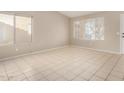 Bright living room with tile floors and large window at 432 E Harrison St, Chandler, AZ 85225