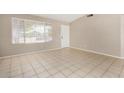 Living room with tile floors and neutral walls at 432 E Harrison St, Chandler, AZ 85225