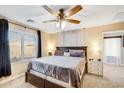 Spacious bedroom with large windows, ceiling fan, and carpet at 4678 E Jadeite Dr, San Tan Valley, AZ 85143