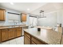 Eat-in kitchen with wood cabinets and an island at 4678 E Jadeite Dr, San Tan Valley, AZ 85143