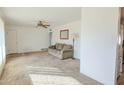 Bright living room with neutral walls and carpeted floor at 6016 N 36Th Dr, Phoenix, AZ 85019