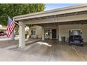 Home exterior featuring carport and golf cart at 7737 E Columbine Way, Mesa, AZ 85208