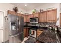 Modern kitchen with stainless steel appliances and granite countertops at 846 N Pueblo Dr # 104, Casa Grande, AZ 85122