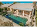 Inviting kidney-shaped pool with a covered patio at 8833 W Tierra Buena Ln, Peoria, AZ 85382