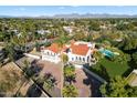 Luxury home with pool, expansive lawn, and mountain views at 8915 N Invergordon Rd, Paradise Valley, AZ 85253