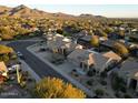 Aerial view of a residential neighborhood with mountain views at 9439 E Palm Tree Dr, Scottsdale, AZ 85255