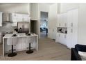 Bright kitchen features a center island with bar stool seating and modern appliances at 9439 E Palm Tree Dr, Scottsdale, AZ 85255