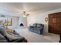 Cozy living room featuring a fireplace and comfortable seating at 12012 N Saguaro Blvd # 6, Fountain Hills, AZ 85268