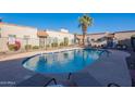 Community swimming pool with lounge chairs at 12012 N Saguaro Blvd # 6, Fountain Hills, AZ 85268