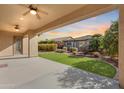 Covered patio overlooks a grassy backyard, perfect for outdoor enjoyment at 12629 W Bajada Rd, Peoria, AZ 85383