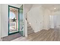 Bright entryway with wood-look floors and a staircase at 1349 N Balboa --, Mesa, AZ 85205