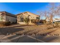 One-story house with a cactus and mature desert landscaping in the front at 14836 W Desert Hills Dr, Surprise, AZ 85379