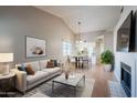 Bright living room with fireplace and dining area at 170 E Guadalupe Rd # 174, Gilbert, AZ 85234