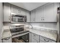 Modern kitchen with stainless steel appliances and granite countertops at 1720 E Thunderbird Rd # 2010, Phoenix, AZ 85022