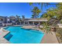 Refreshing community pool with lounge chairs and surrounding patio at 1720 E Thunderbird Rd # 2010, Phoenix, AZ 85022