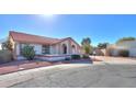 Single-story home with red tile roof and a landscaped front yard at 1745 N Terrace Cir, Casa Grande, AZ 85122