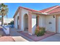 Arched entryway and walkway to a single-story home at 1745 N Terrace Cir, Casa Grande, AZ 85122