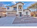 Two-story house with stone accents and a two-car garage at 2327 W Branham Ln, Phoenix, AZ 85041