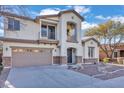 Two-story house with stone accents and a two-car garage at 2327 W Branham Ln, Phoenix, AZ 85041