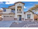 Two-story house with stone accents and a two-car garage at 2327 W Branham Ln, Phoenix, AZ 85041