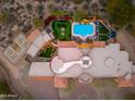 Luxury home showcasing a pool, putting green, and basketball court at 23414 N 84Th Pl, Scottsdale, AZ 85255