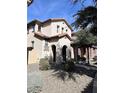 Two-story home with Spanish-style architecture and landscaping at 26015 N 53Rd Dr, Phoenix, AZ 85083