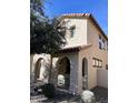 Tan two-story home with arched entryway and patio at 26015 N 53Rd Dr, Phoenix, AZ 85083